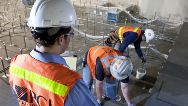 PCI workers safely installing a raised access floor