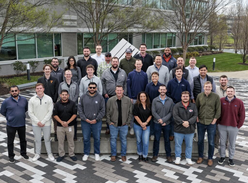 Boot camp group pose outside of PCI campus