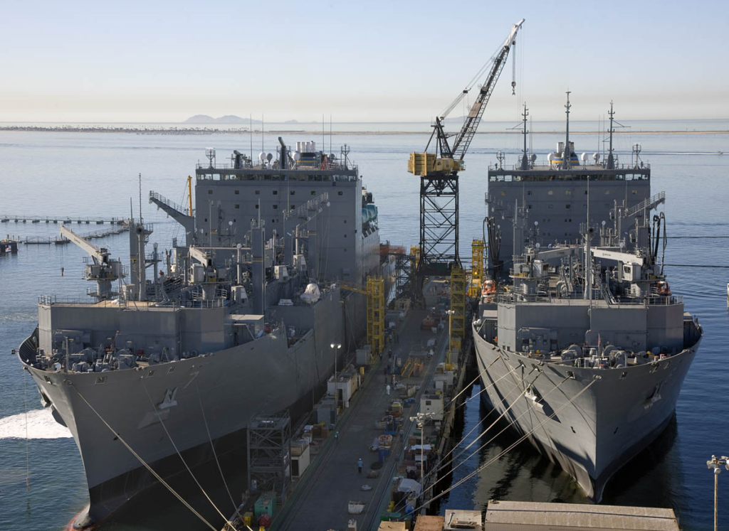 Two ships at a port being built