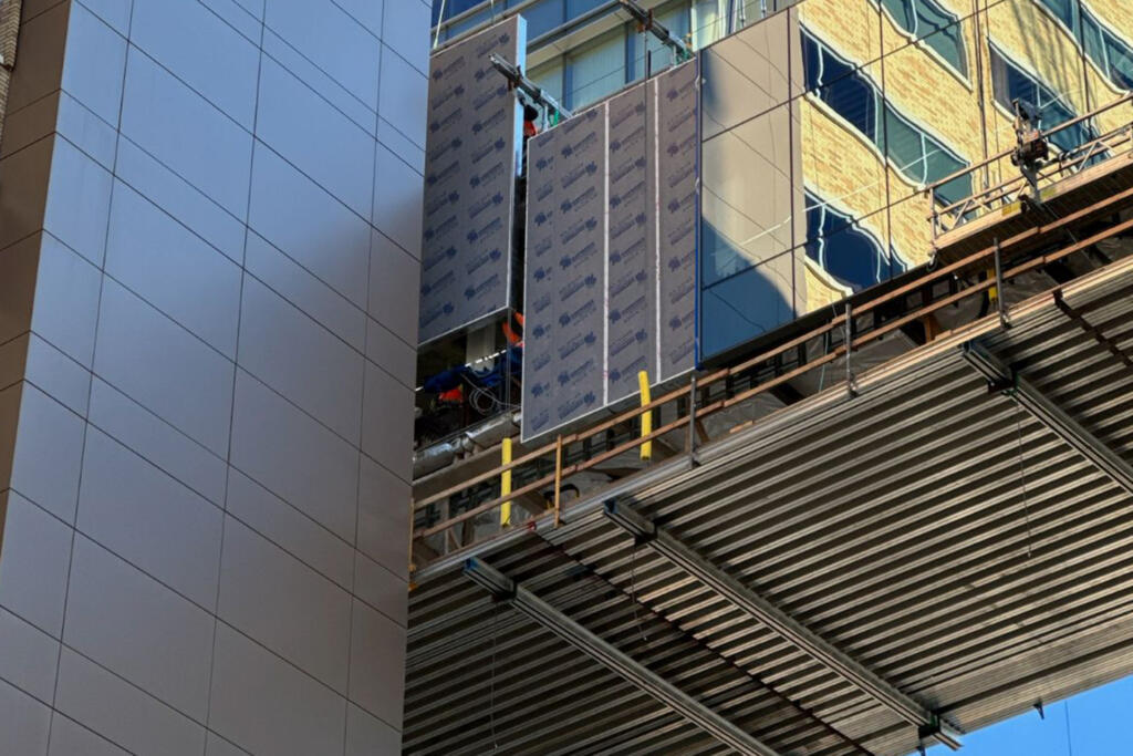 prefabricated panels being installed on commerical building